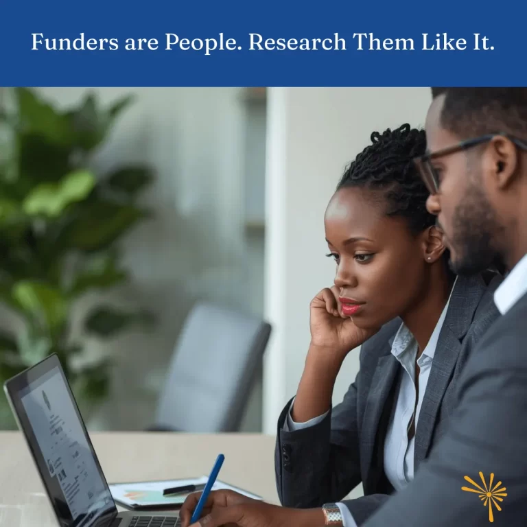 A fundraiser reviewing a funder profile on a laptop